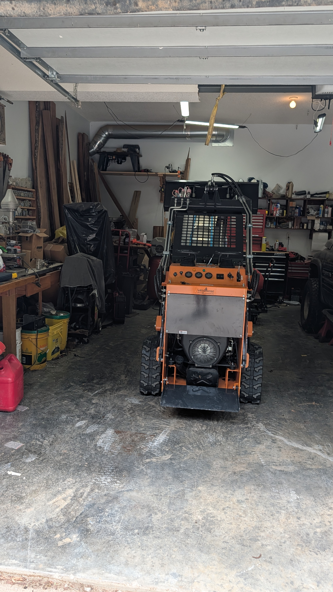 Mini skid-steer loader inside the workshop